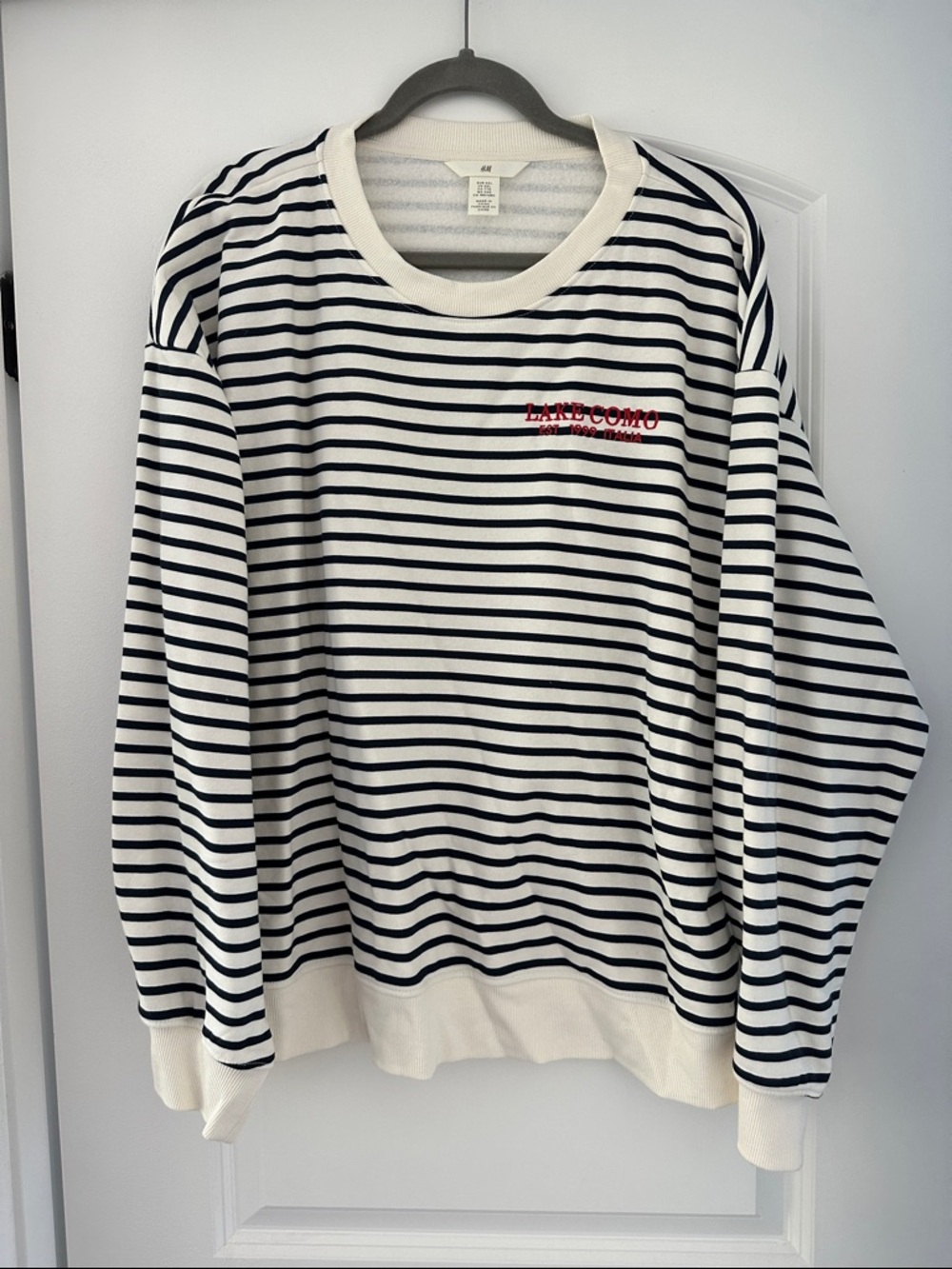 H&M White and Black Striped Crewneck Sweater with Red Embroidered Logo